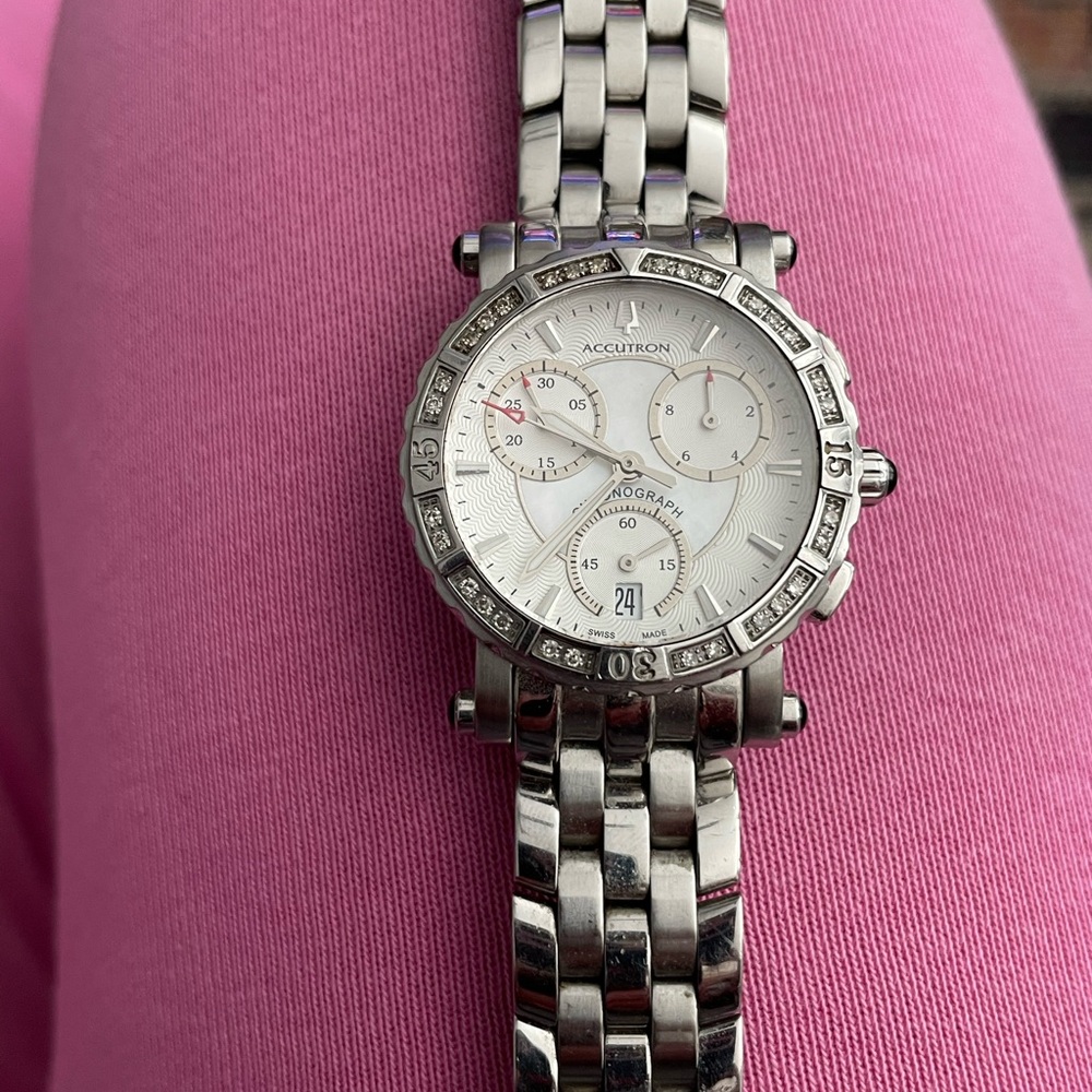 Bulova Diamond Bezel Watch with White Dial and Stainless Steel Bracelet.